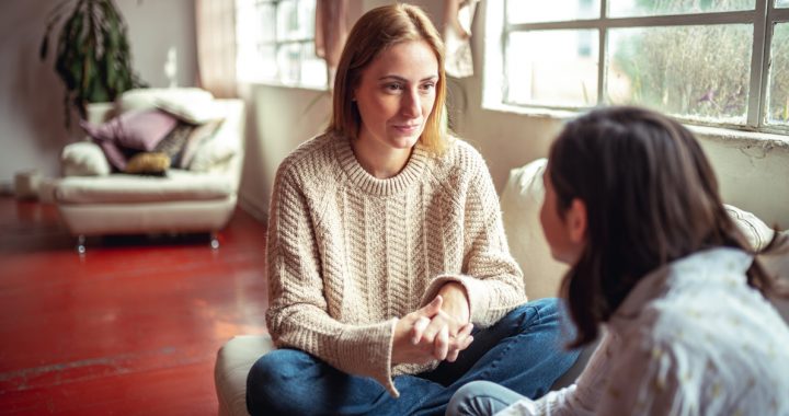 Mother talking to her daughter about COVID-19