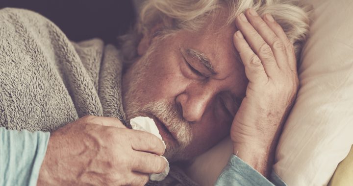 Sick man managing his illness symptoms at home