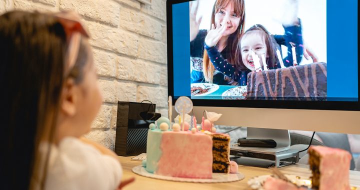 Family hosting a virtual birthday party for their child during COVID-19.