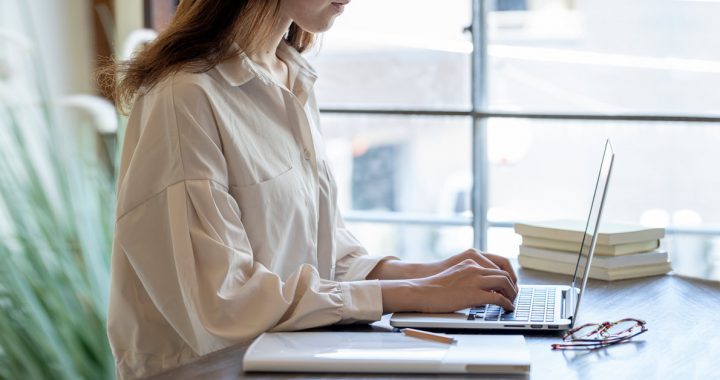 Woman working in her in home work space during COVID-19.