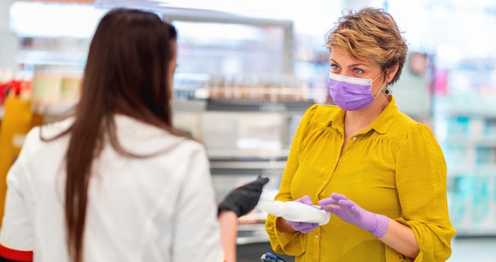 Woman shopping with latex gloves during COVID-19.