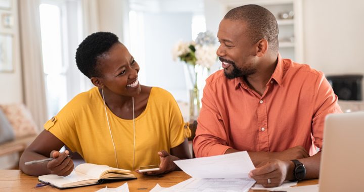 A couple creating their COVID-19 plan at their house.