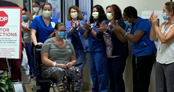 Lisa Joyce being discharged from Bon Secours Mary Immaculate Hospital after recovering from COVID-19 thanks to convalescent plasma treatment.