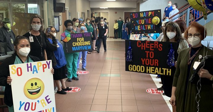 Staff members at Bon Secours Marvyiew Medical Center celebrating Mrs. Wilson's "Code Happy" celebration.