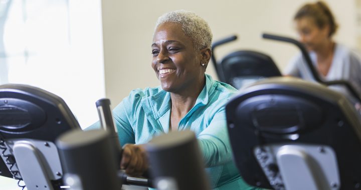 A woman doing cardio at the gym during COVID-19