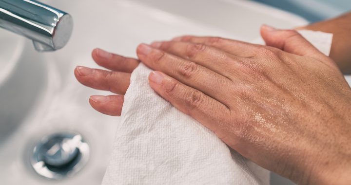 A person with dry hands from lots of handwashing.