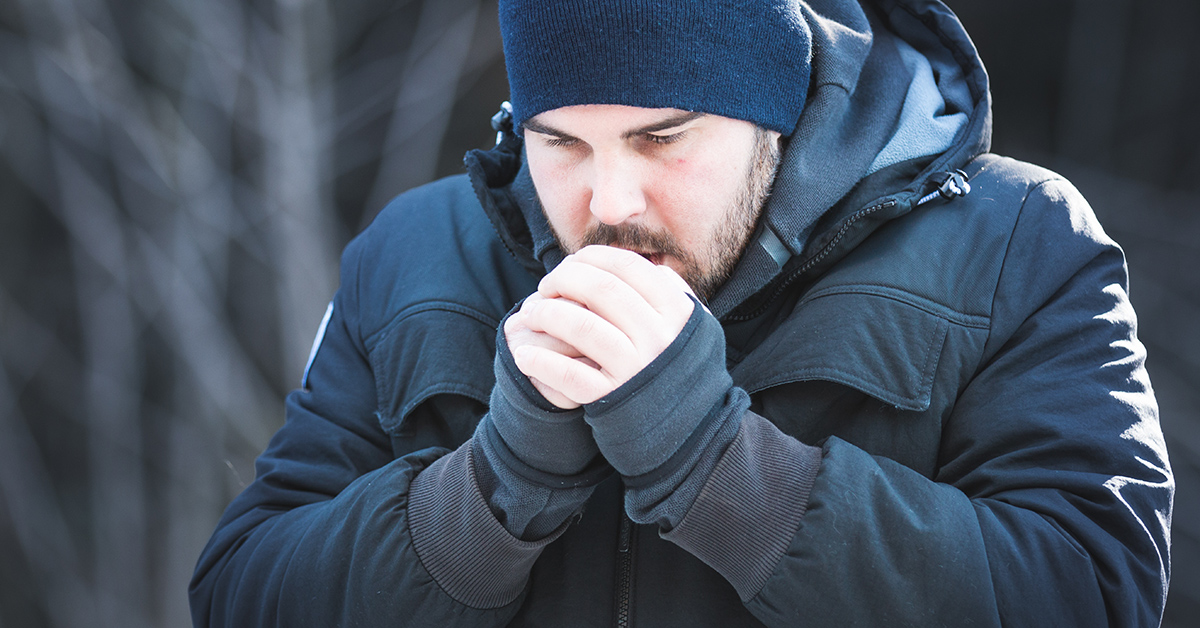 A man shivering during the winter.