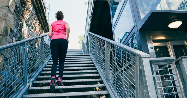 A woman climbing stairs for exercise.