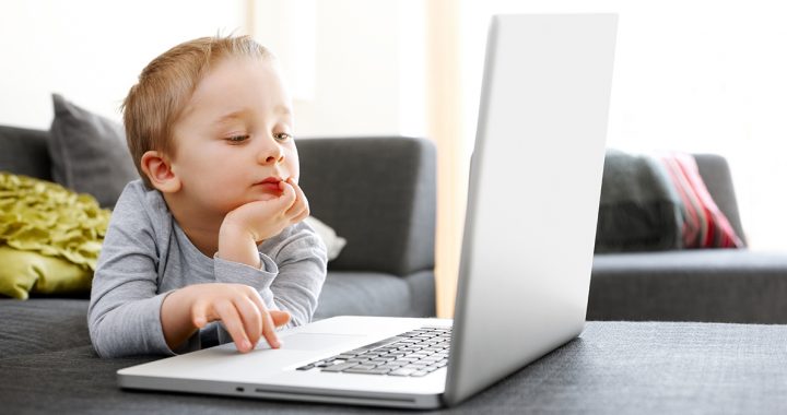 A child looking at a computer screen.