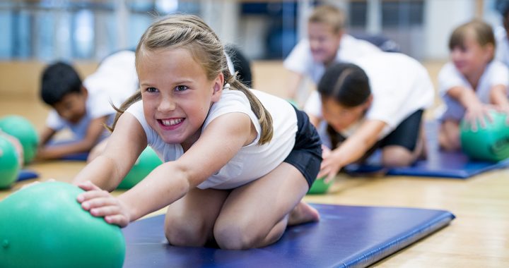 A child participating in PE class at school.