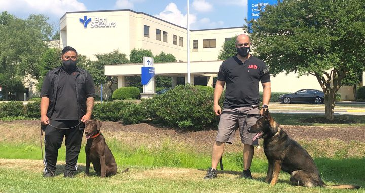 AK9I dogs and their trainers outside of Mary Immaculate Hospital