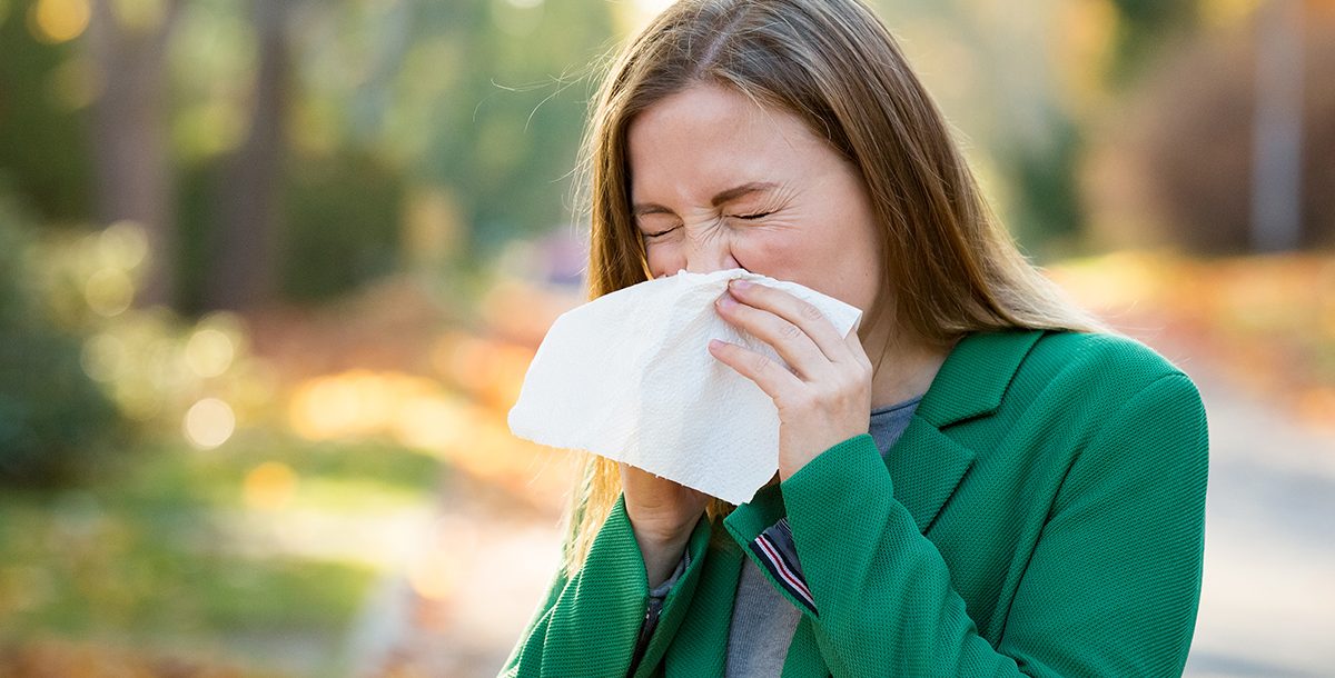 A woman suffering from fall allergies.