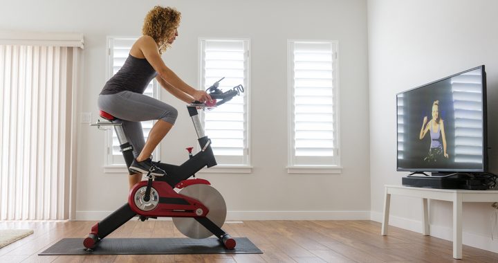 a woman cycling indoors